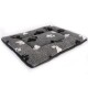 Gray pet bed with a soft, fluffy texture, featuring black and white paw print patterns.