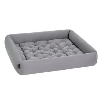 Graues Hundebett mit gestepptem Design und erhöhten Rändern, ideal für Hunde oder Katzen, vor einem weißen Hintergrund präsentiert.
