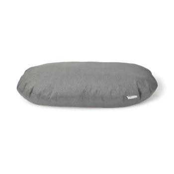 Gray oval pet bed with a soft fabric texture, featuring a small label on the side.