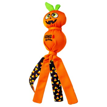 Orange KONG pumpkin dog toy with jack-o'-lantern face, green leaf stem, two knotted balls and candy-corn legs.