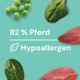 Das Bild zeigt grüne Erbsen, Spinatblätter und rohes Pferdefleisch, mit dem Text "82 % Pferd" und "Hypoallergen."