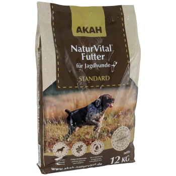 Ein 12 kg Sack AKAH NaturVital Hundefutter für Jagdhunde, mit einem braun-beigen Design und einem Bild eines laufenden Hundes sowie Text in Deutsch.