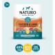Naturo dog food packaging showcases chicken, lamb, rice, and veggies, with 65% meat, no nasties, for adult dogs 1-7 years.