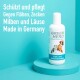 Flasche mit GREEN HERO Floh- und Zeckenshampoo für Haustiere, mit einer Katze und einem Hund auf dem Etikett, mit deutschem Text über Schutz und Pflege.
