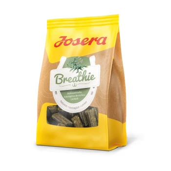 Eine gelbe Tüte Josera Hundeleckerlis mit der Aufschrift 'Breathie', mit Eukalyptus- und Bronchialgeschmack, mit dem Text 'Natürlich - Verträglich - Lecker.'