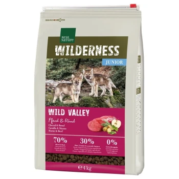 4kg bag of Real Nature Wilderness Junior dog food with "Wild Valley" label, featuring wolf pups and 70% horse/beef, 30% fruits/veggies.