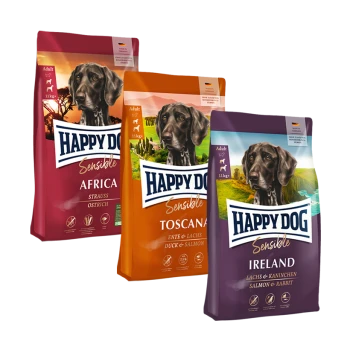Drei Tüten Happy Dog Sensible Hundefutter: Afrika (Strauß), Toscana (Ente & Lachs) und Irland (Lachs & Kaninchen), jeweils mit 11 kg beschriftet.