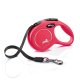 A bright pink retractable dog leash with a black strap and silver clip, featuring a silhouette of a dog and the text "CLASSIC" and "MADE IN GERMANY."
