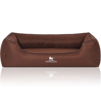 Braunes Hundebett mit erhöhtem Rücken und Seiten, mit dem Logo "KNUFFELWUFF" auf der Vorderseite.