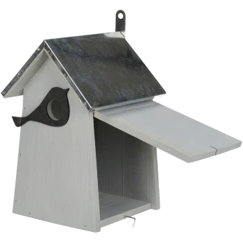 A wooden birdhouse with a metallic roof, featuring a bird silhouette design on the side and an open front door.
