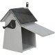 A wooden birdhouse with a metallic roof, featuring a bird silhouette design on the side and an open front door.