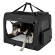 Eine schwarze tragbare Hundebox mit einem Netzfront, mit einem Hund, der teilweise herauskommt. Die Box hat ein weiches Innenleben und Seitentaschen.