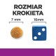 Obrazek porównujący rozmiar krokietów karmy dla zwierząt, pokazujący 7 mm okrągły krokiet obok 16 mm niebieskiej kostki, z napisem "ROZMIAR KROKIETA."