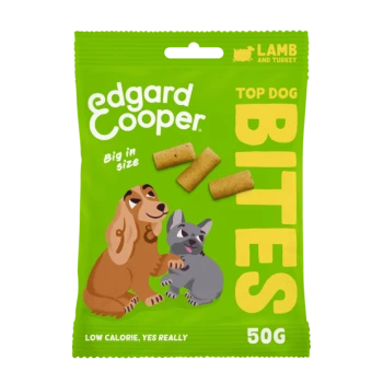 Green packaging featuring Edgard Cooper's "Top Dog Bites" with images of a brown dog and a gray dog, highlighting lamb and turkey flavor.