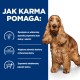 Brązowy pies na niebieskim tle podkreśla korzyści żywieniowe dla skóry, zdrowia sierści i jakości stolca.