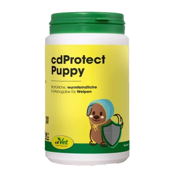 Weißes Glas mit grünem Deckel, Aufdruck 'cdProtect Puppy' und 'cdVet' auf gelbem Etikett; Cartoon-Welpe mit Schild und deutschem Anti-Wurm-Fütterungstext