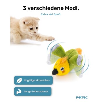 Ein cremefarbener Kätzchen spielt mit einem bunten Vogelspeilzeug. Der Text hebt "3 Modi", "Ungiftige Materialien" und "Lange Lebensdauer" hervor.