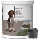 Behälter mit Reavet Heilmoor für Hunde, mit dem Etikett "Optimale Verdauung & Kotbeschaffenheit," neben einem kleinen Schälchen mit schwarzer Substanz.