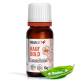 Flasche REAVET Rauf Bold, ein natürliches Haustierergänzungsmittel gegen Aggression, mit 10g Produkt und weißen Pellets auf einem grünen Blatt.