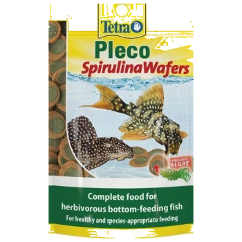 Tetra Pleco Spirulina Wafers package with two bottom-feeding fish illustrations and text: "Complete food for herbivorous fish."