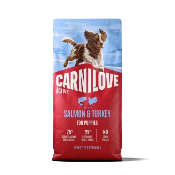 Sac CARNILOVE Active pour chiots rouge avec chien bondissant, étiqueté « Saumon & Dinde pour chiots ».