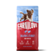 Sac CARNILOVE Active pour chiots rouge avec chien bondissant, étiqueté « Saumon & Dinde pour chiots ».