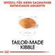 Bild eines Krokettenstücks, das für Dalmatiner entworfen wurde, mit dem Text 'TAILOR-MADE KIBBLE' und 'SPEZIELL FÜR IHREN DALMATINER ENTWICKELTE KROKETTE' darüber.