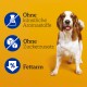 Ein Hund steht vor einem leuchtend gelben Hintergrund, mit Text, der "Ohne künstliche Aromastoffe," "Ohne Zuckerzusatz," und "Fettarm" anzeigt.