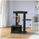 Un chat tigré orange joueur grimpe sur un arbre à chat noir avec des poteaux à gratter et des jouets suspendus, dans un salon confortable.
