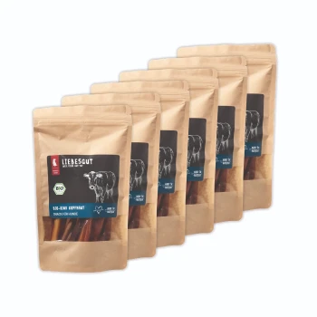 Sechs wiederverschließbare Kraftbeutel Liebesgut-Hundesnacks mit Kuh-Illustration und Aufschrift „BIO RIND KOPFHAUT“.