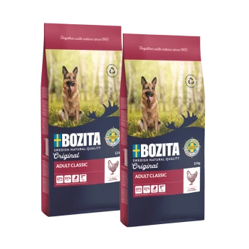 Zwei Beutel Bozita Hundefutter, beschriftet mit 'Original Adult Classic', mit einem Deutschen Schäferhund im Waldhintergrund. Jeder Beutel wiegt 12 kg.