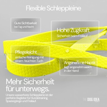 Eine leuchtend gelbe flexible Hundeleine auf einer nassen Oberfläche, die ihre Sichtbarkeit, Stärke, einfache Reinigung und Komfort zeigt.