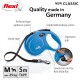 Blue flexi dog leash with ergonomic grip, sturdy tape, and comfortable braking system; features a connection slot for flexi Multi Box.
