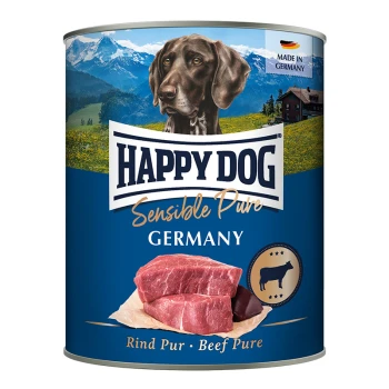 Dosen-Hundefutter mit der Aufschrift "Happy Dog Sensible Pure" mit einem braunen Hund vor einer Berglandschaft, mit rohen Rindfleischstücken.