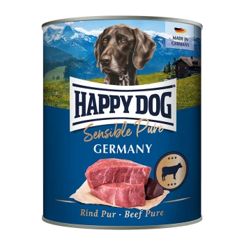 Dosen-Hundefutter mit der Aufschrift "Happy Dog Sensible Pure" mit einem braunen Hund vor einer Berglandschaft, mit rohen Rindfleischstücken.
