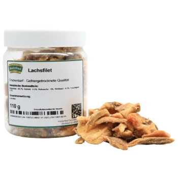 Gefriergetrocknete Lachsfilet-Hundeleckerlis in einem klaren Glas mit dem Etikett 'Lachsfilet' und Nährwertangaben sowie Zutaten.