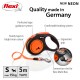 Flexi retractable dog leash in neon orange, featuring an ergonomic grip, a sturdy tape system, and a connection slot for accessories.