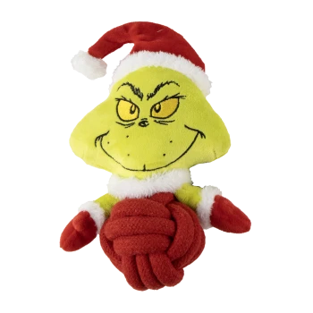 Plush Grinch dog toy wearing a red Santa hat and mittens, holding a red knotted rope ball.