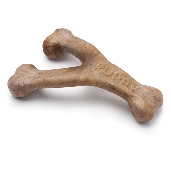 A chew toy shaped like a bone, labeled "PUPPY," designed for young dogs, featuring a light brown color and textured surface.