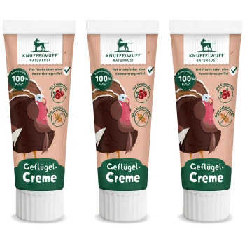 Drei Tuben Knuffelwuff Geflügel-Creme mit einem Cartoon-Puten, gekennzeichnet mit "100% Pute," mit Symbolen für Cranberries und getreidefrei.
