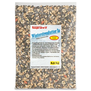 Nahaufnahme von gemischtem Vogelfutter mit Sonnenblumenkernen, Erdnüssen und Körnern für Ziervögel.