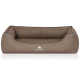 Ein gemütliches, braunes Hundebett mit einem gerippten Innenraum und einer glatten Außenseite, mit dem Logo 'KNUFFELWUFFF' auf der Vorderseite.