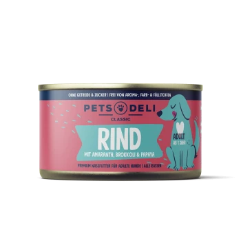 Dosenfutter für Hunde, beschriftet mit "RIND" mit Amaranth, Brokkoli und Papaya. Enthält einen Cartoonhund und Text, der angibt, dass es für erwachsene Hunde ist.