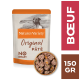 Emballage de nourriture pour chiens Nature's Variety Original Pâté avec une image de chien, étiqueté "Sans céréales" et "Boeuf", avec un bol de pâté.