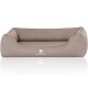 Ein gemütliches, taupefarbenes Hundebett mit erhöhten Seiten und einem weichen Kissen, mit dem Logo 'KNUFFELWUFF' auf der Vorderseite.
