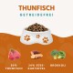 Haustierfutternapf gefüllt mit Trockenfutter, beschriftet mit "THUNFISCH GETREIDEFREI", mit Zutaten: 50% Thunfisch, 24% Süßkartoffel und Brokkoli.