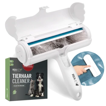 Selbstreinigender Tierhaarbürster in Weiß und Blau, mit einer Box im Hintergrund, die "REAVET care me Tier Cleaner" und "For Pet Lovers" beschriftet ist.