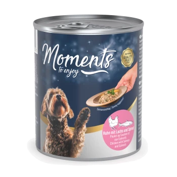A can of pet food labeled "Moments to enjoy," showing a dog with a raised paw and a hand serving "Chicken with Salmon and Spinach."