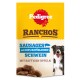 Pedigree RANCHOS Hundesnack-Tüte mit der Aufschrift 'SAUSAGES mit 100% NATÜRLICHEM SCHWEIN', mit Wurstabbildung und lächelndem Hund.