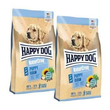 Zwei Beutel Happy Dog NaturCroq Puppy Hundefutter mit einem Golden Retriever Welpen und Sonnenblumengrafiken.